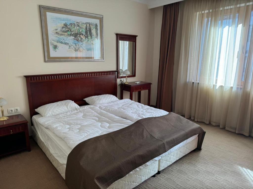 Postel nebo postele na pokoji v ubytování Downtown Bansko Resort