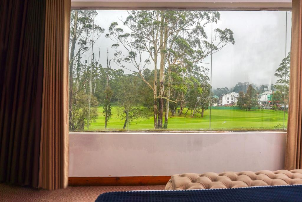 a view from a window of a golf course at Hills City Apartments in Nuwara Eliya