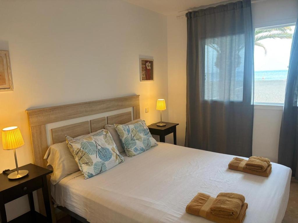 En eller flere senge i et værelse på Apartamento Sofia