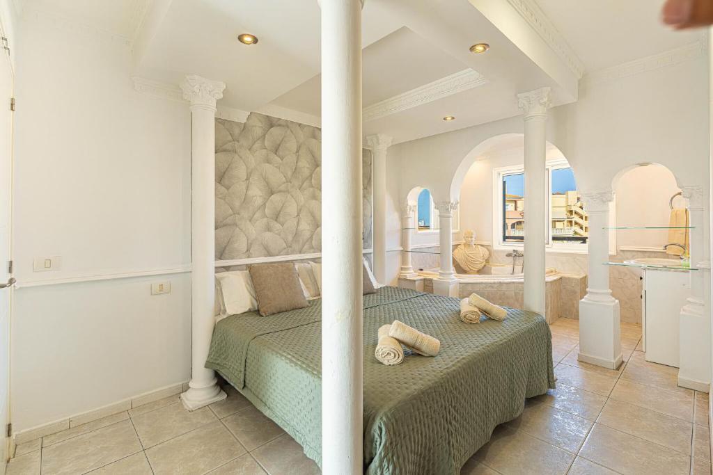 a bedroom with a bed with two pillows on it at As de Casas - Parque Albatros 2 in San Miguel de Abona