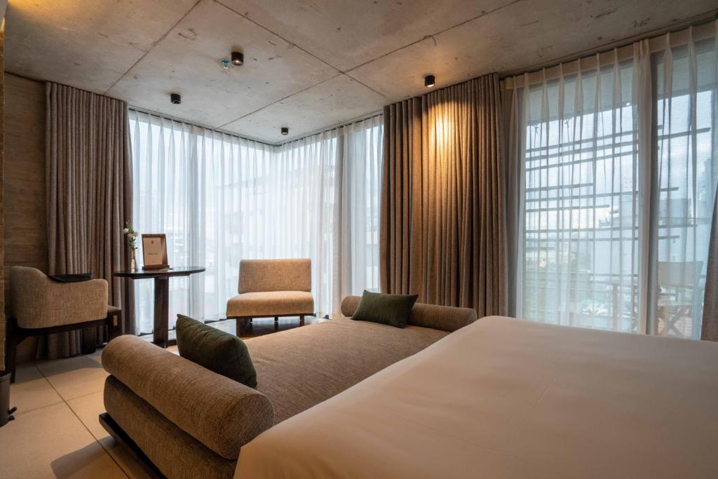 Кровать или кровати в номере Hôtel de Soie