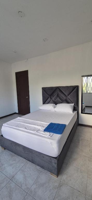 Postel nebo postele na pokoji v ubytování ASL HOME CALI NORTE - Hospedaje AV 6A