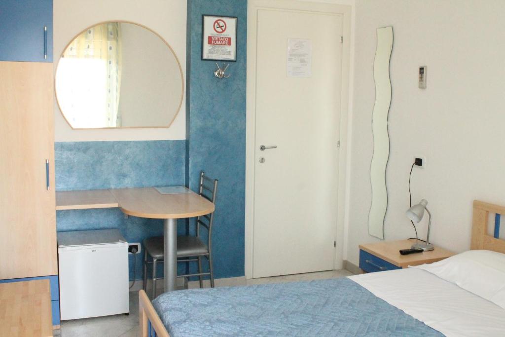 Postel nebo postele na pokoji v ubytování B&B Brezza Marina & Ristorante Shoreline