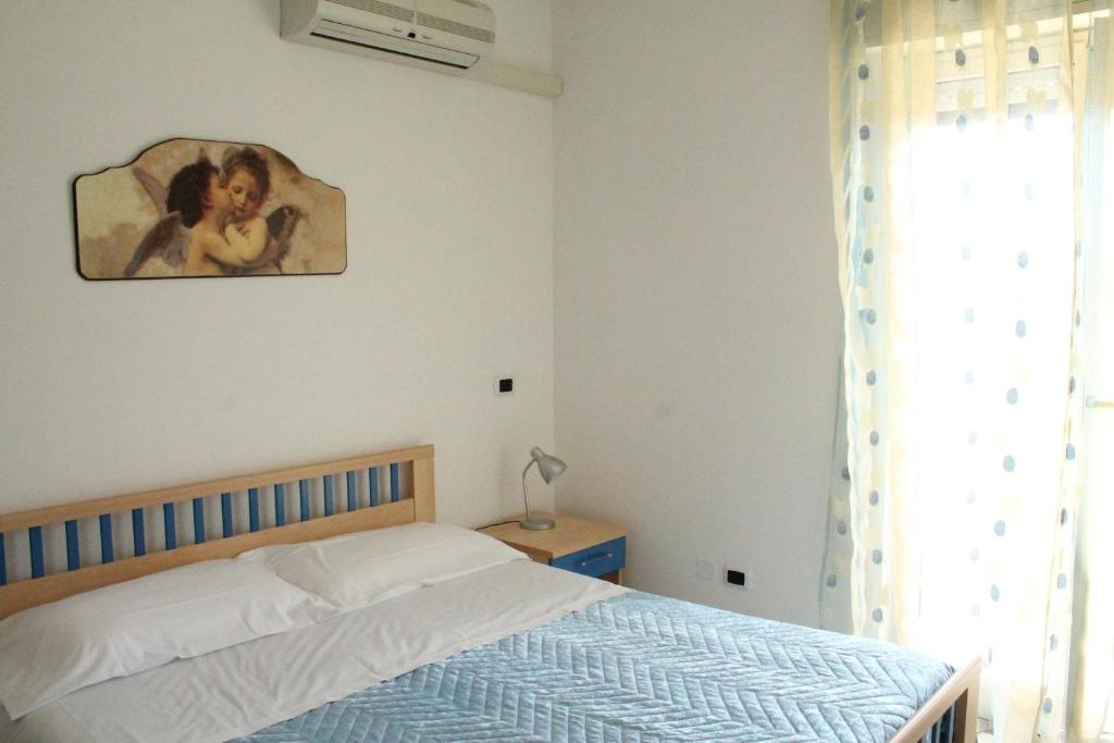 Postel nebo postele na pokoji v ubytování B&B Brezza Marina & Ristorante Shoreline