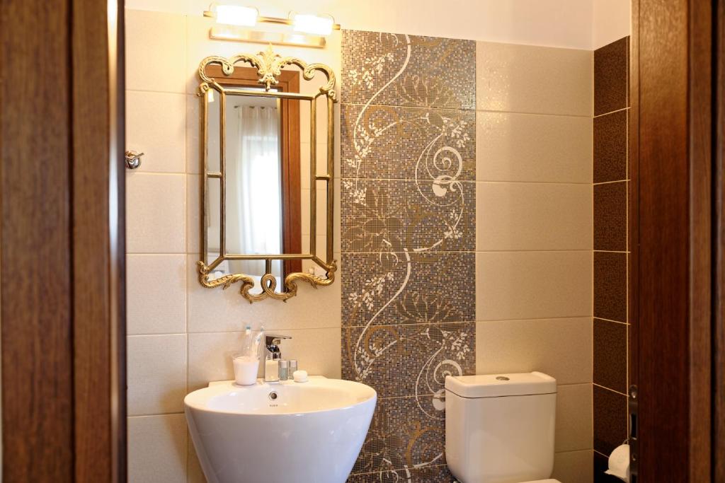Koupelna v ubytování Alexandra Hotel