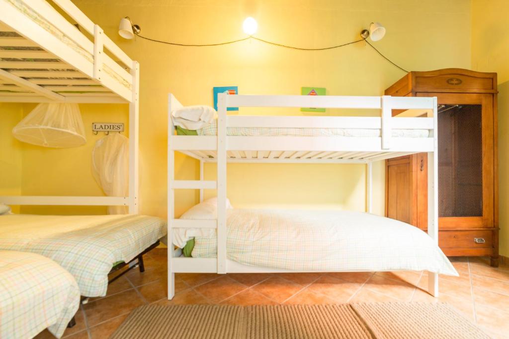 Postel nebo postele na pokoji v ubytování Villa Lupita