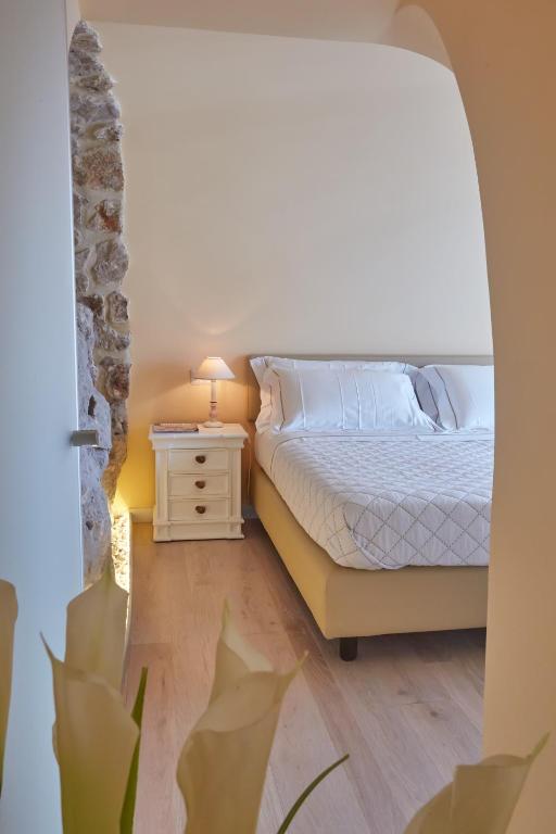 Postel nebo postele na pokoji v ubytování Casa Boutique by Capri 5 Senses