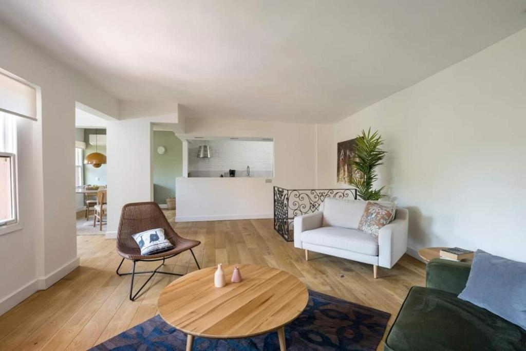 a living room with a couch and a table at Beautiful Modern Bright 2bd Patio Duplex #179 in Istanbul