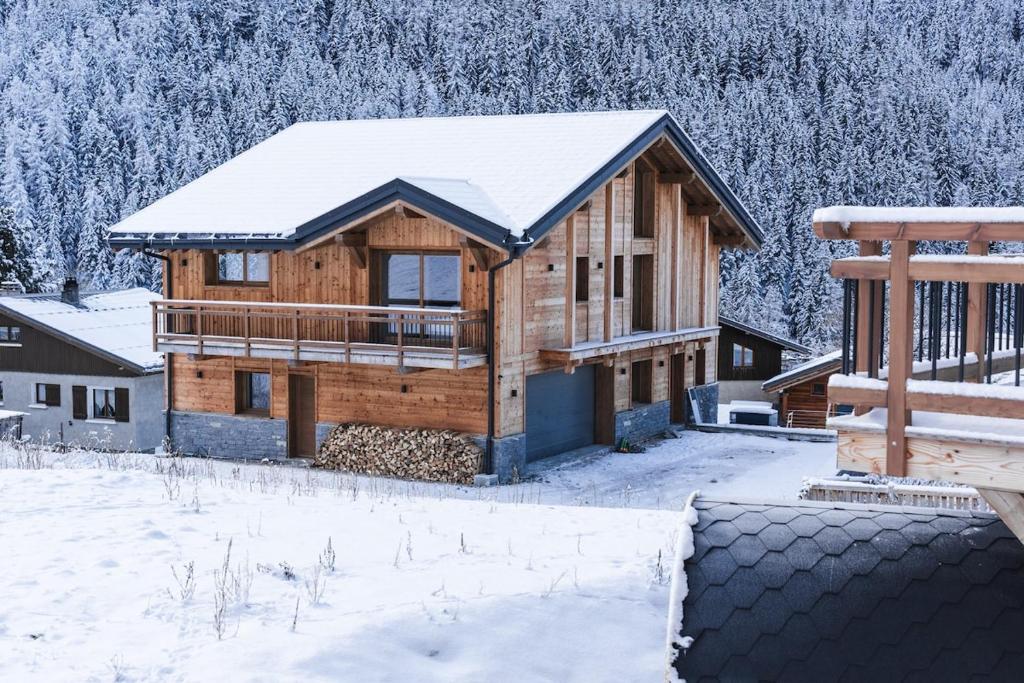 a log home in the snow with snow covered trees at CHALET ALIET 1500 - 18 personnes PEISEY NANCROIX - LES ARCS - LA PLAGNE - PARADISKI in Peisey-Nancroix