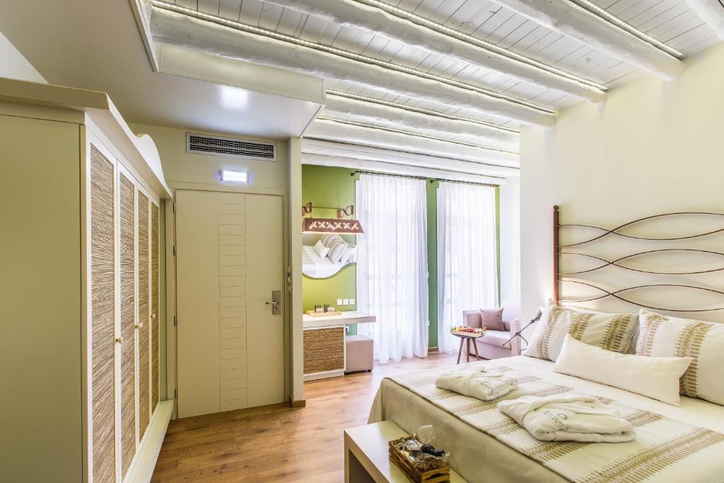 Postel nebo postele na pokoji v ubytování Sette Venti Boutique Hotel