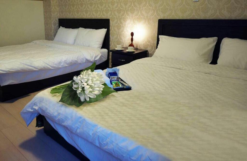 Ένα ή περισσότερα κρεβάτια σε δωμάτιο στο Ximen NIANIA