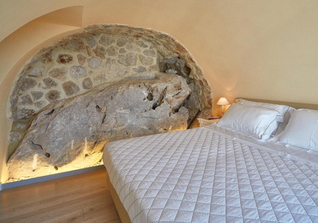 Postel nebo postele na pokoji v ubytování Casa Boutique by Capri 5 Senses