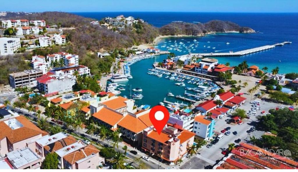 an aerial view of a harbor with boats in the water at Casa Estrellas in Santa Maria Huatulco
