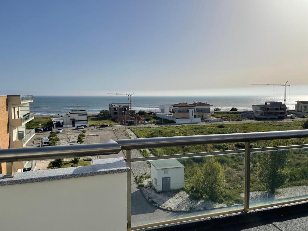 a view of the beach from the balcony of a condo at Atlantic Foz in Buarcos