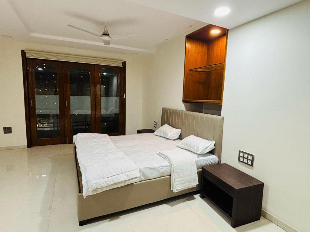 a bedroom with a bed and a cabinet in it at The Dream Stay in Varanasi