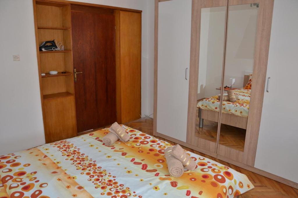 Postel nebo postele na pokoji v ubytování MG apartments and rooms