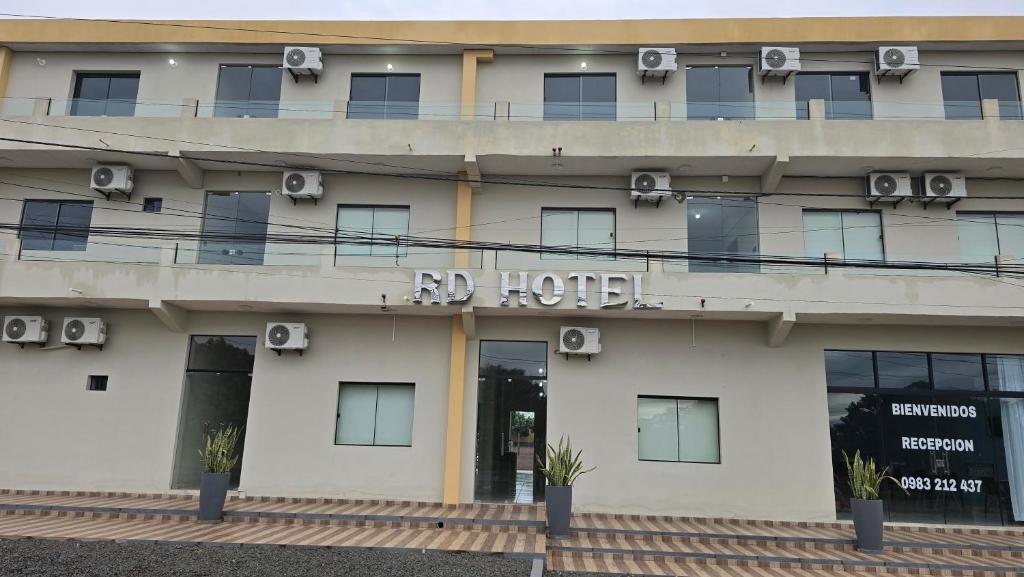 a hotel with a sign on the front of it at Rd hotel in Colonia Felicidad