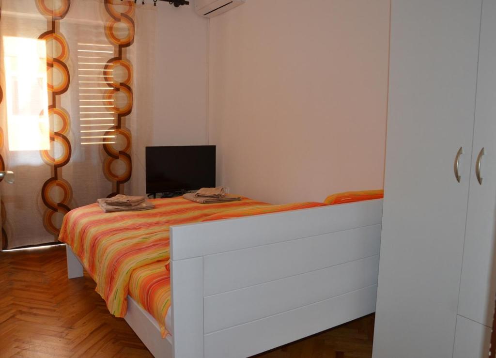Postel nebo postele na pokoji v ubytování MG apartments and rooms