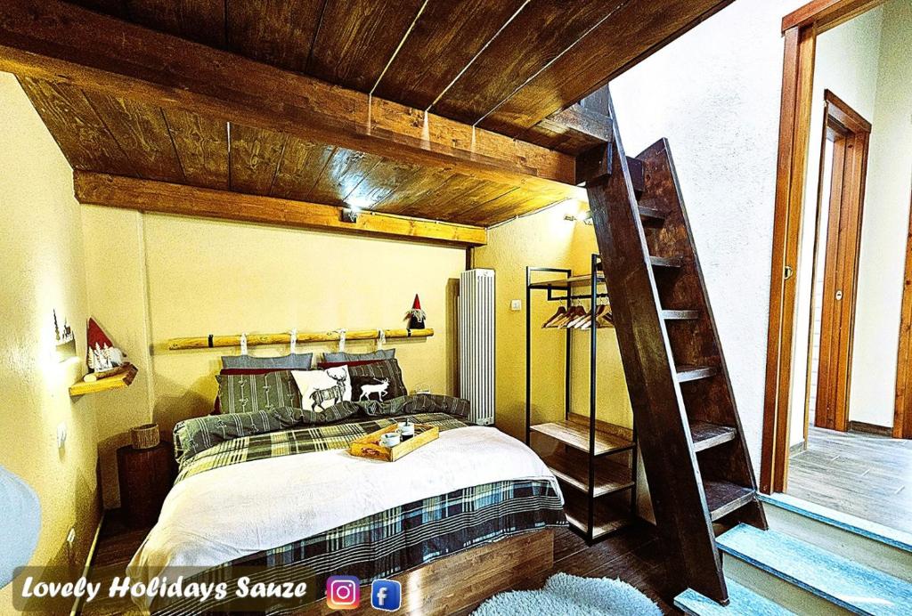 a bedroom with a large bed with a wooden ceiling at BAITA LOVELY AND CENTRAL SAUZE D'OULX in Sauze dʼOulx
