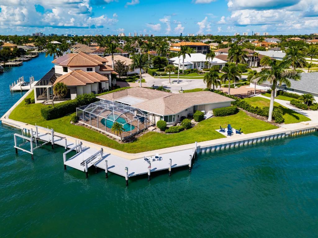 an aerial view of a house on a dock at Waterfront Hideaway | Panoramic Bay Views in Marco Island