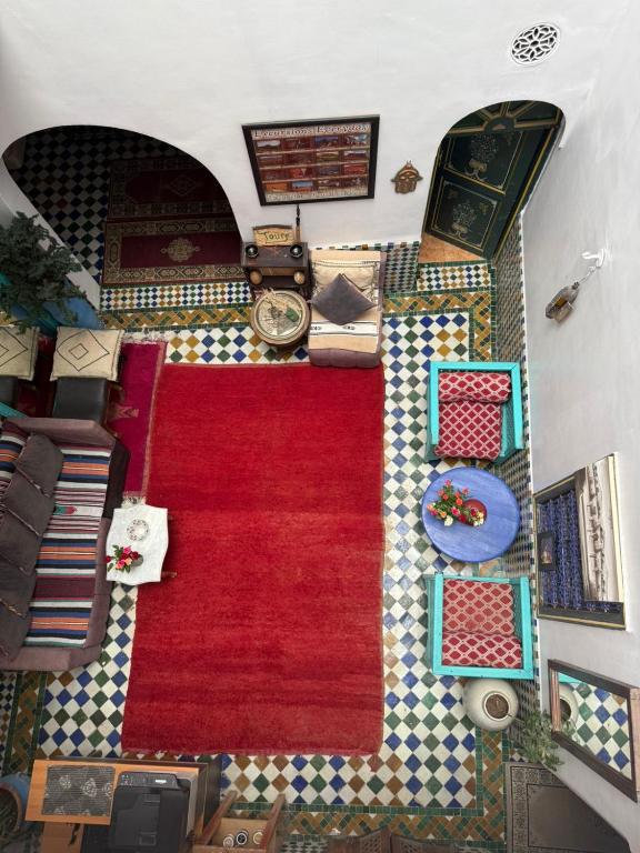 an overhead view of a living room with a red carpet at Casa del Sol Marrakech in Marrakesh