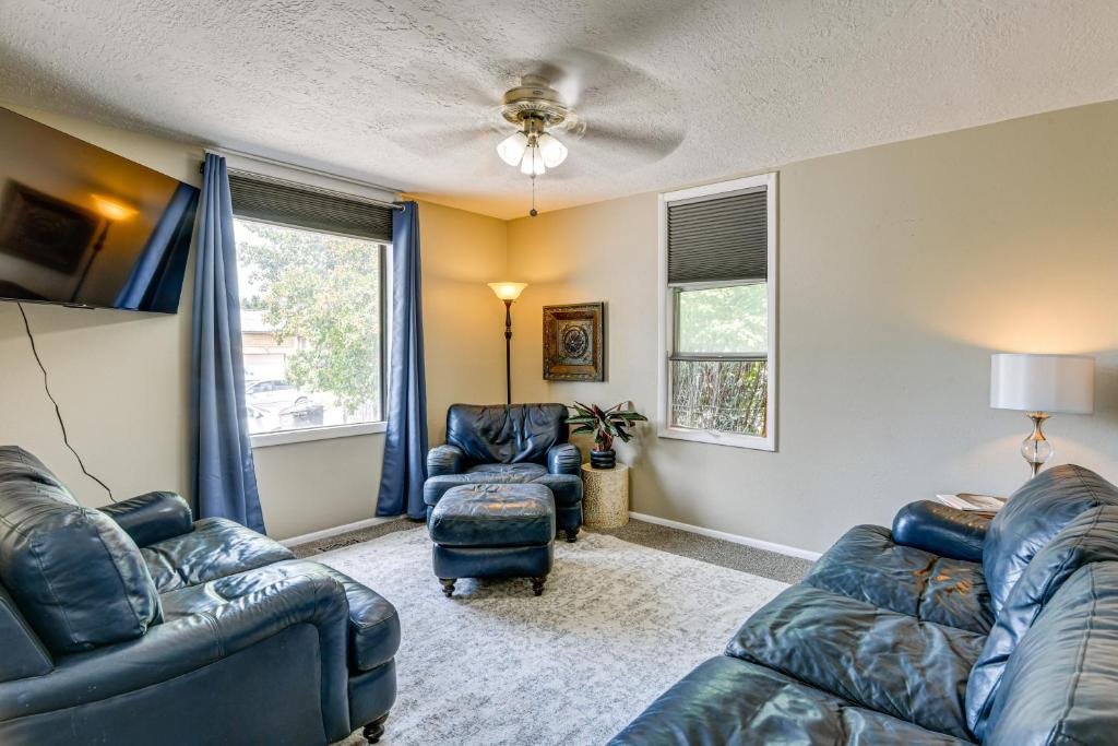 a living room with two blue couches and a window at 17 Mi to Bear Lake Lovely Family Home! in Montpelier