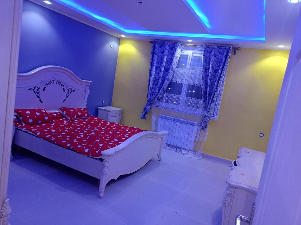 En eller flere senge i et værelse på Location Appartement avec Piscine