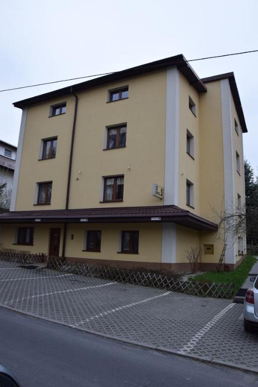 a large building on the side of a street at Willa Urocza in Lublin