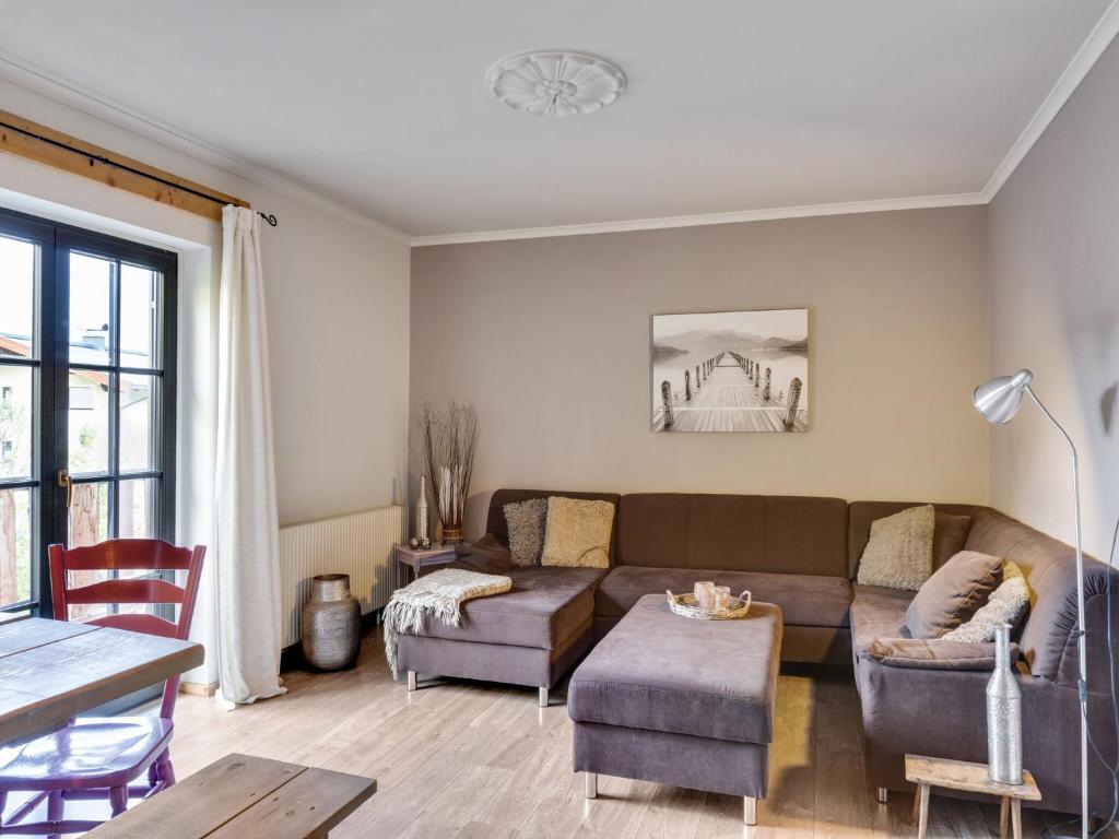 a living room with a couch and a table at Chalet in Leogang near Ski Lifts in Leogang