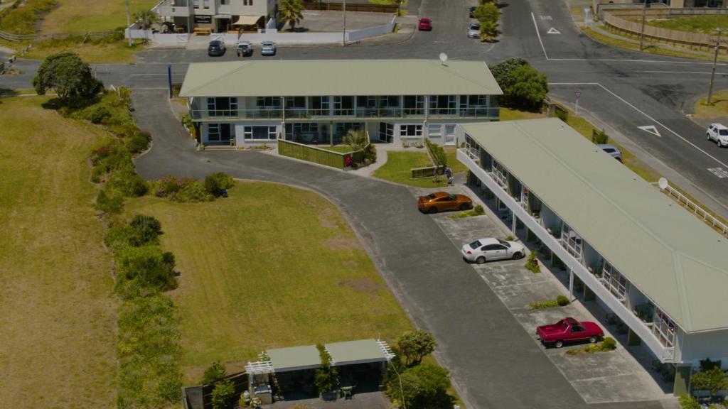 an overhead view of a building with a parking lot at Ruakaka Beach Front Motel in Ruakaka