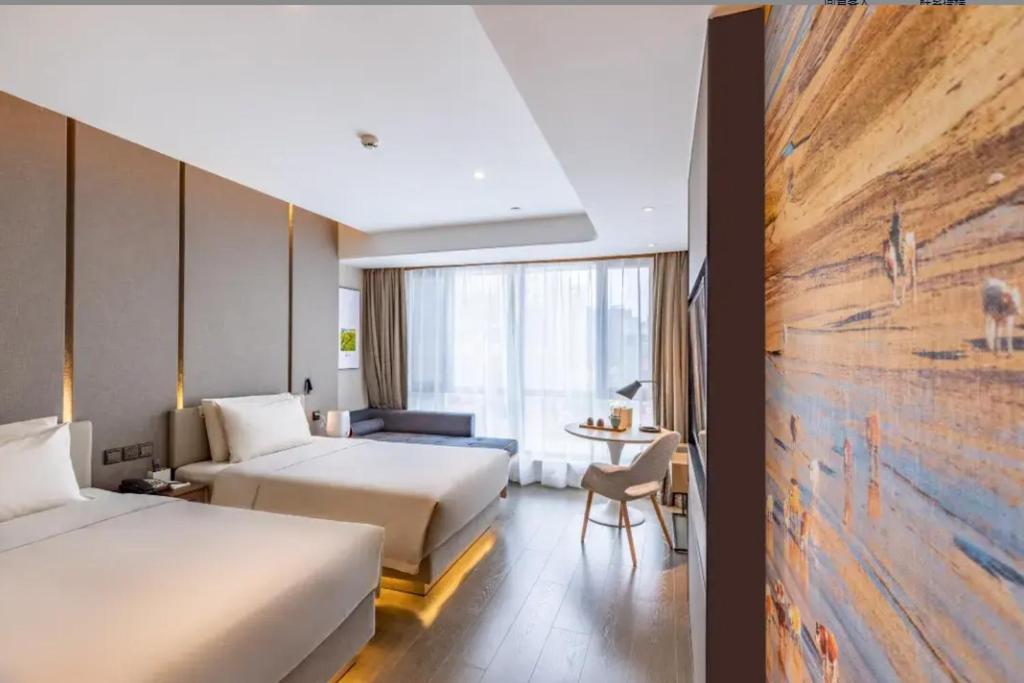 Postel nebo postele na pokoji v ubytování Atour Hotel Hohhot International Convention and Exhibition Center East University Street