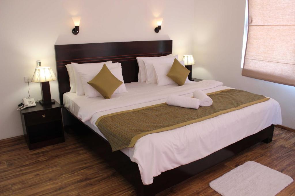 Postel nebo postele na pokoji v ubytování Hillcrest Villa Kandy
