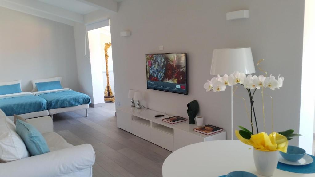 TV a/nebo společenská místnost v ubytování B&B Unique