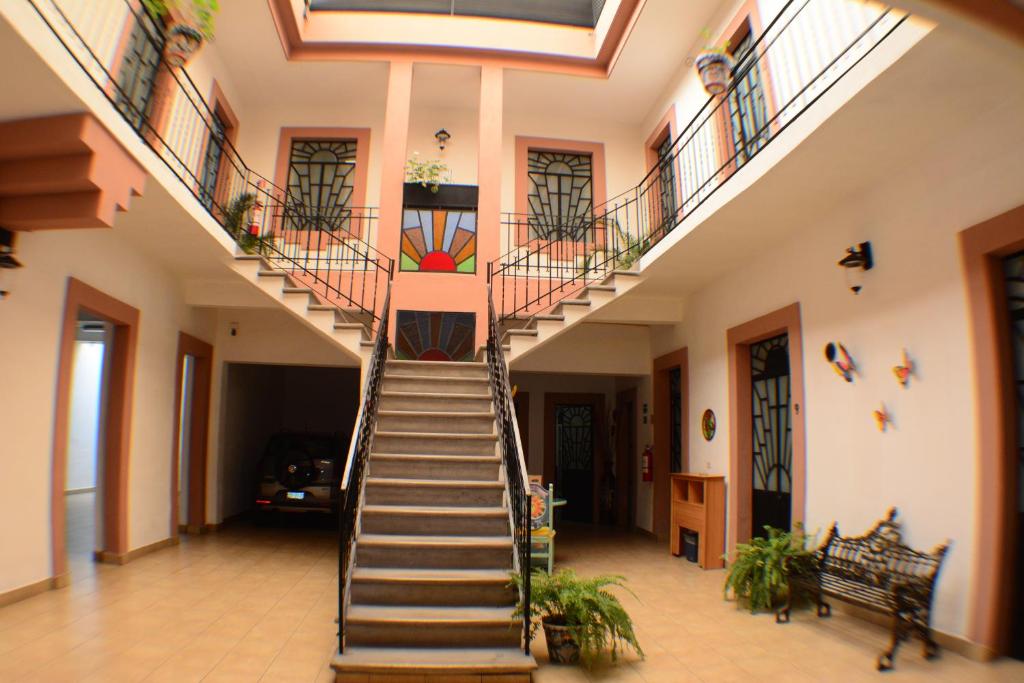 a spiral staircase in a building with a stair case at Hotel del Capitán de Puebla - Vitrales in Puebla