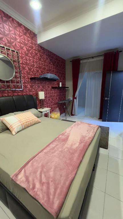 Un pat sau paturi într-o cameră la Md Homestay