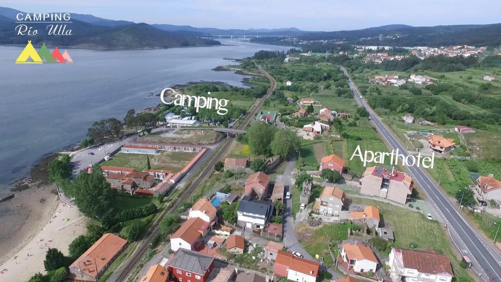 an aerial view of a town next to a river at Apartamentos Turisticos Vilagarcía- Rio Ulla in Vilagarcia de Arousa