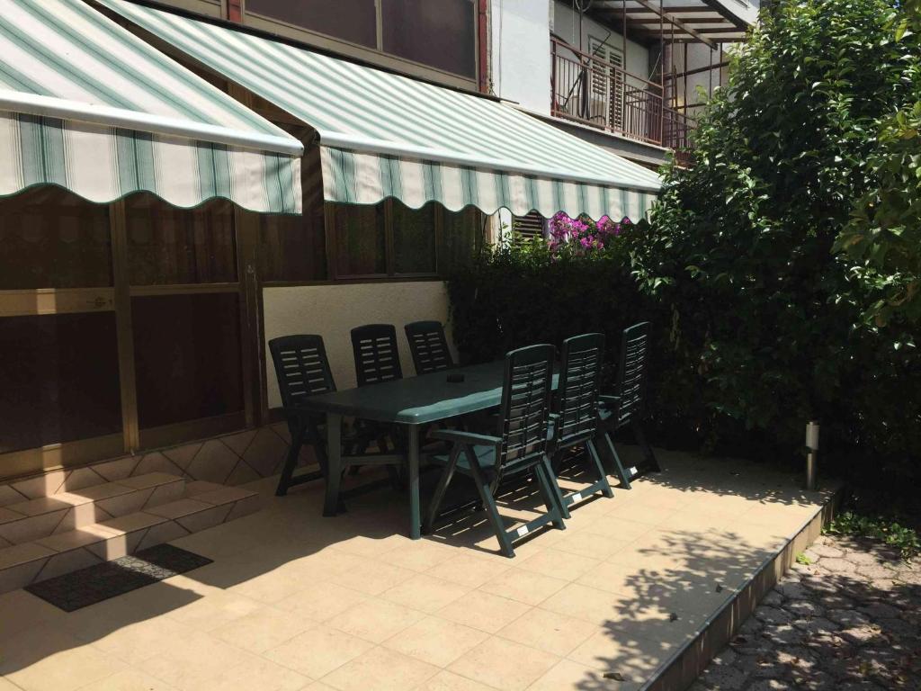 a table and chairs sitting on a patio at Apartments Oliva in Poreč