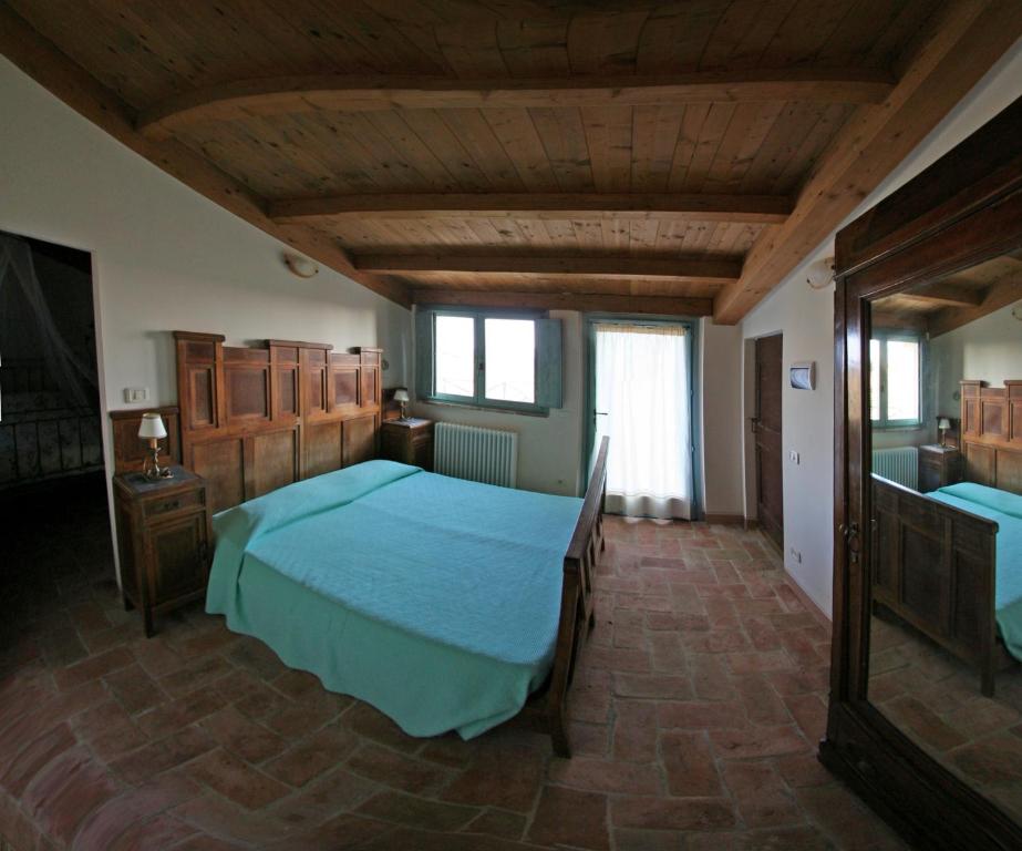 Łóżko lub łóżka w pokoju w obiekcie Locanda San Francesco