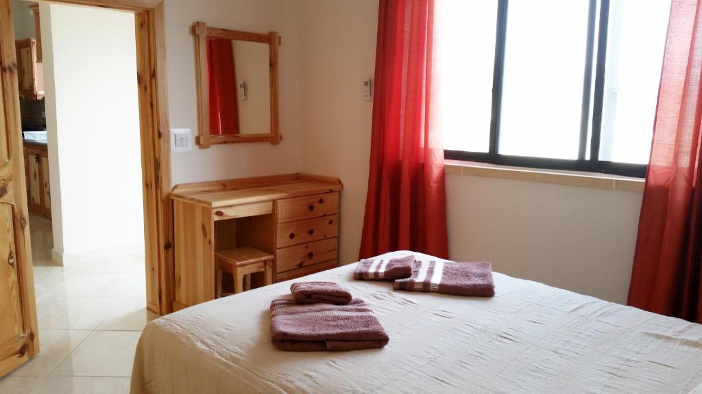 Postel nebo postele na pokoji v ubytování Tal-Marga B&B