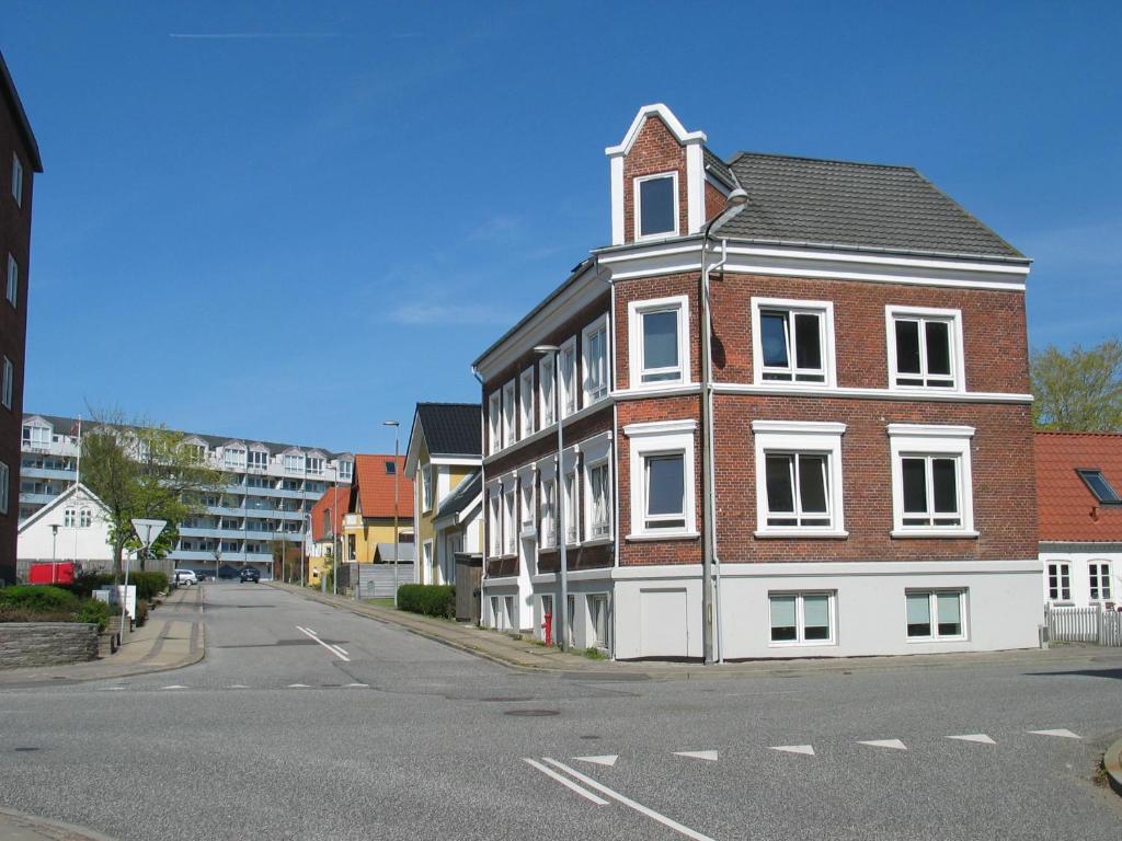 a building on the side of a street at Aalborg City Rooms ApS in Aalborg