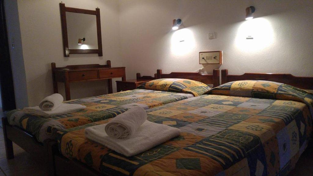 Postel nebo postele na pokoji v ubytování Ipanema Hotel