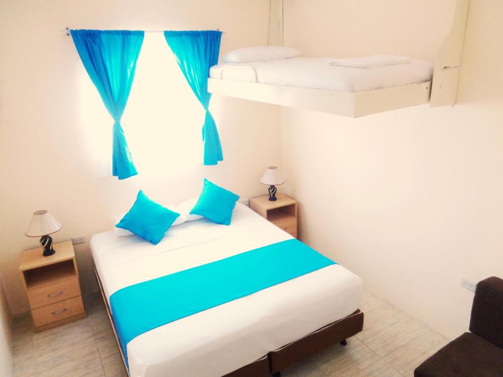 Postel nebo postele na pokoji v ubytování Hotel Crucero