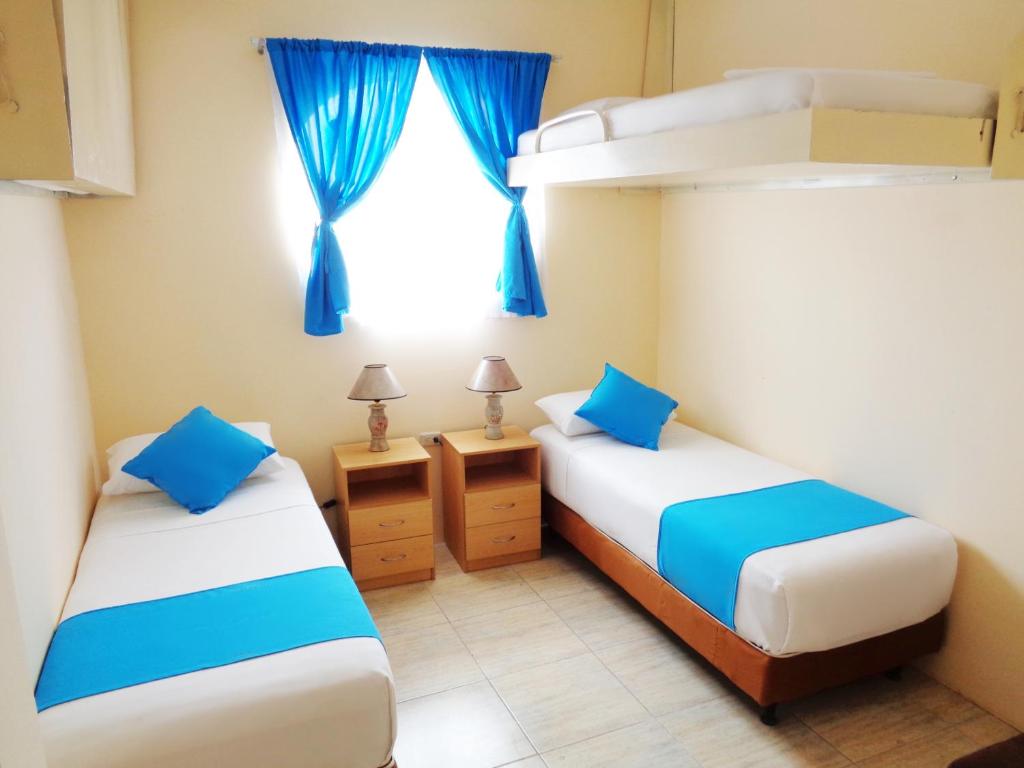 Postel nebo postele na pokoji v ubytování Hotel Crucero