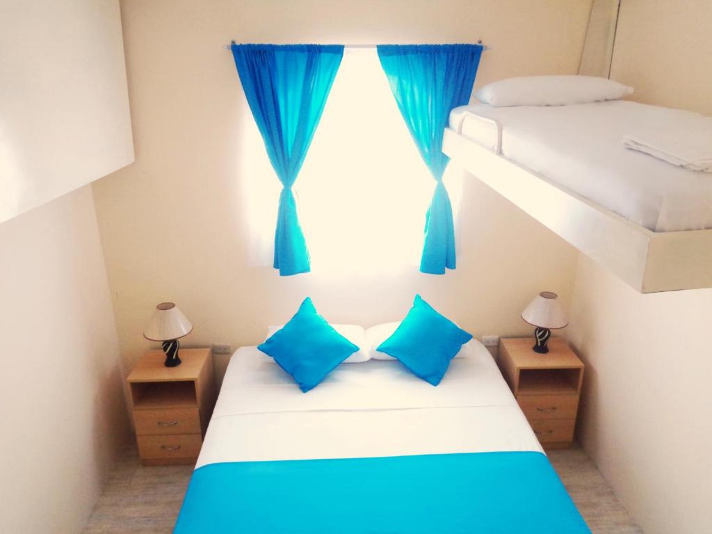 Postel nebo postele na pokoji v ubytování Hotel Crucero