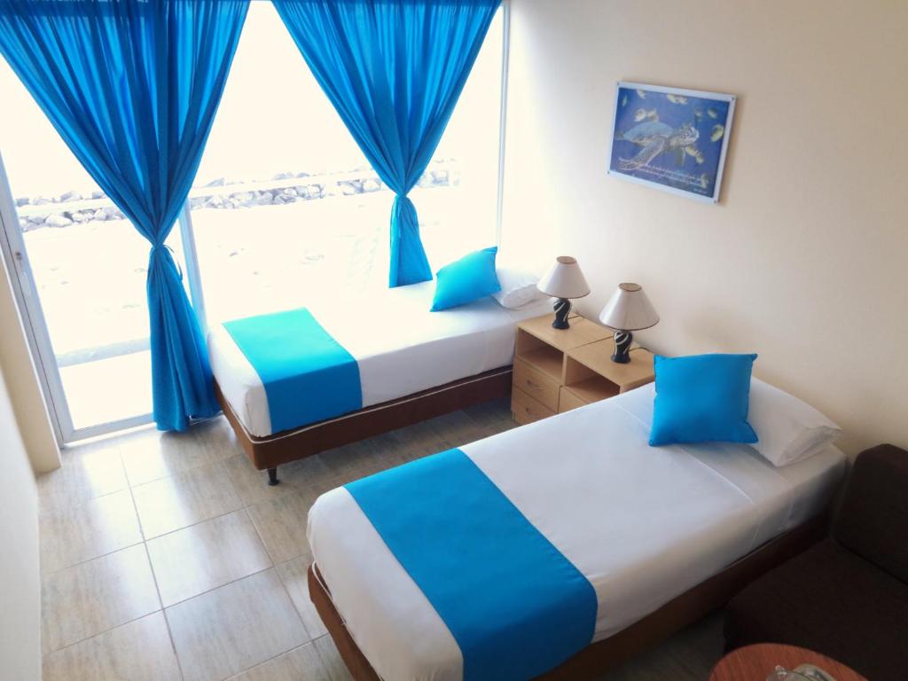 Postel nebo postele na pokoji v ubytování Hotel Crucero