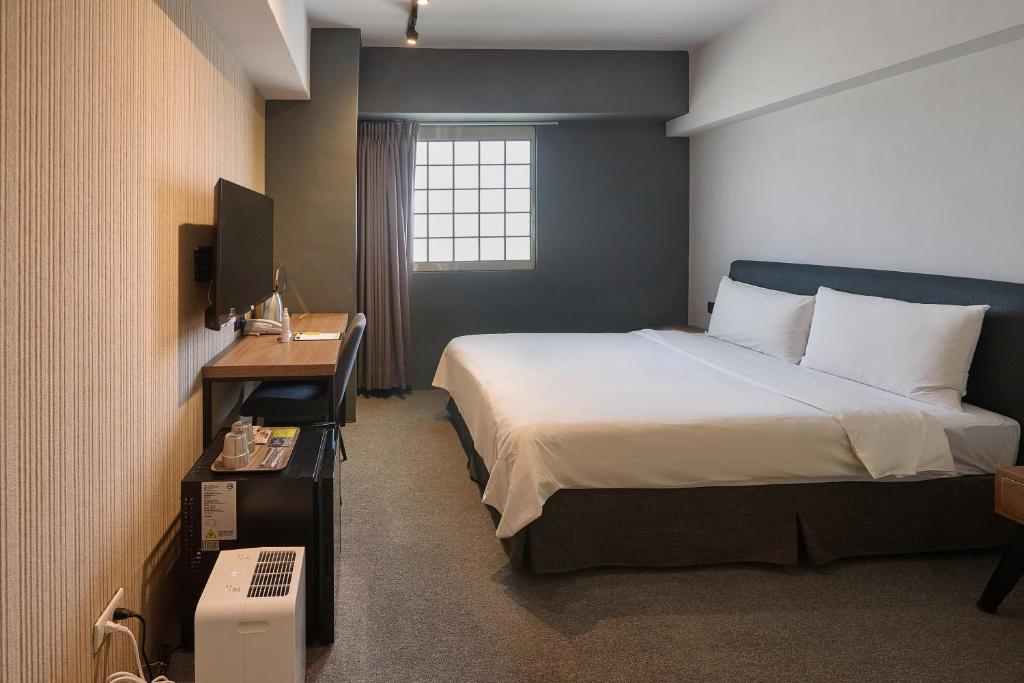 Ένα ή περισσότερα κρεβάτια σε δωμάτιο στο Doudian DDiNN Hotel