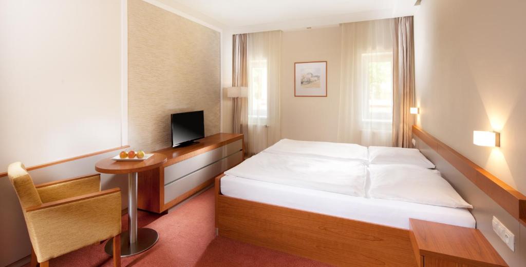 Postel nebo postele na pokoji v ubytování Hotel Reza
