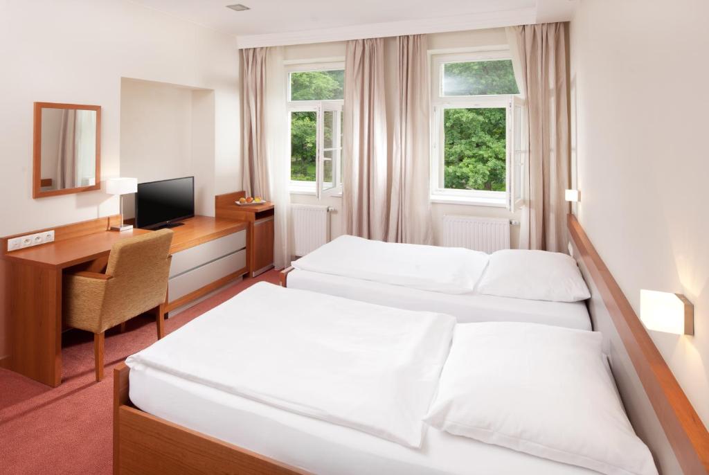 Postel nebo postele na pokoji v ubytování Hotel Reza