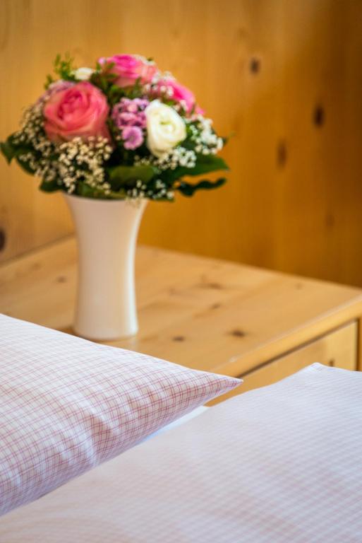 Postel nebo postele na pokoji v ubytování Appartementhaus Alpenrose