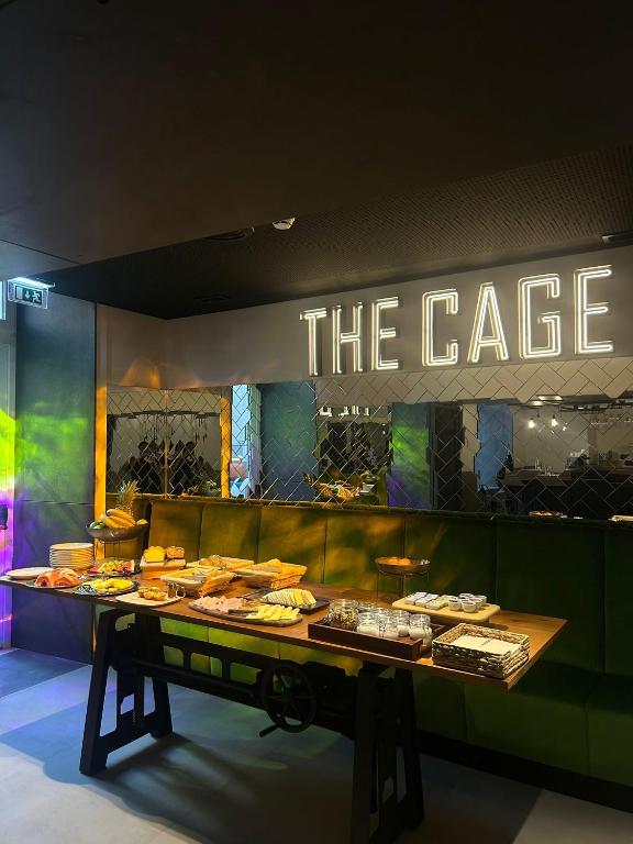 A buffet table laid with pastries, fruit and prepared breakfast items in The Green Café.